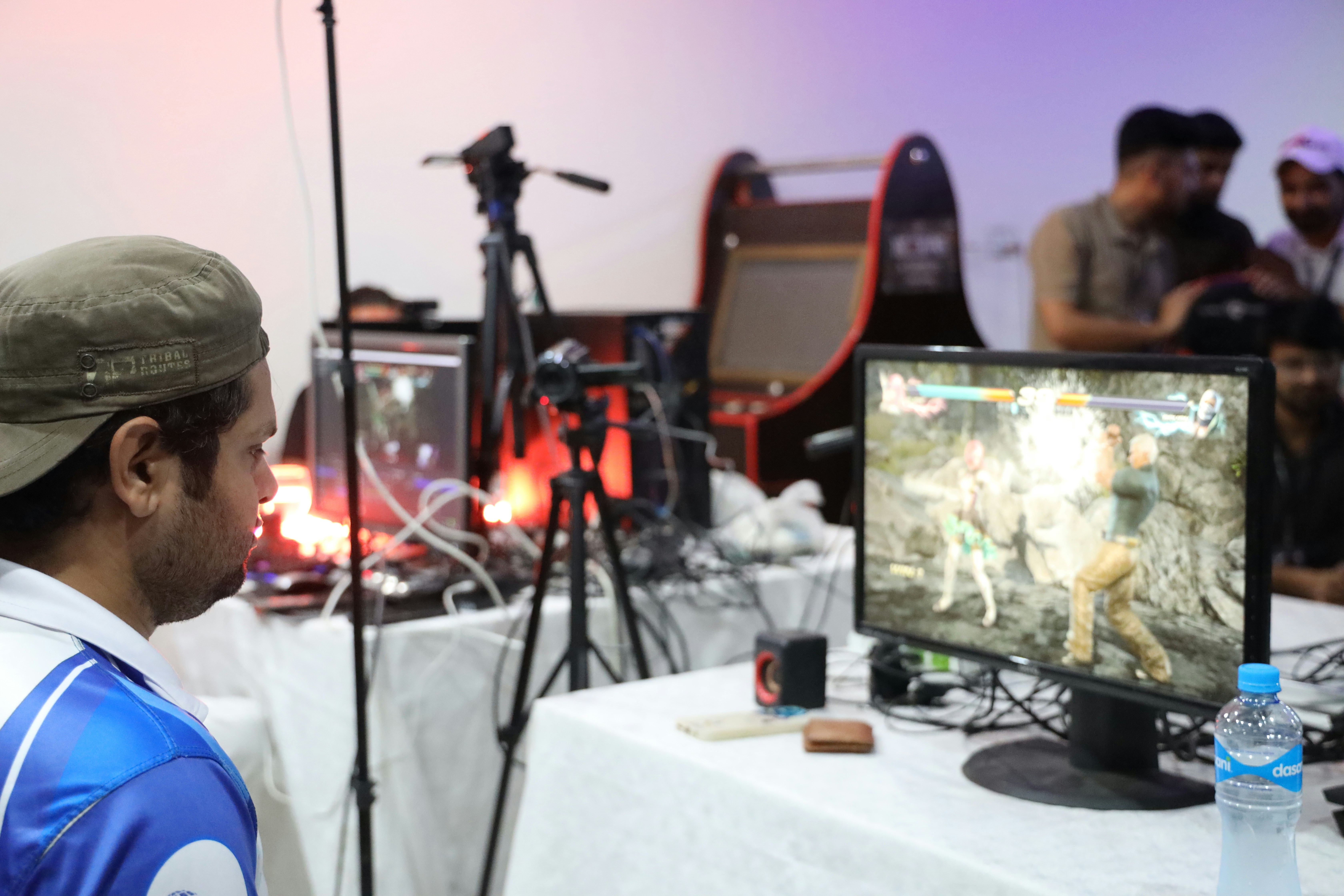 a man sitting in front of a computer monitor